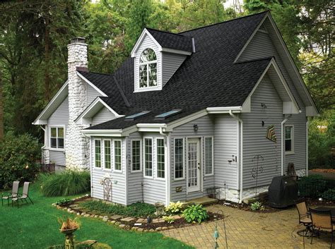 light grey house with metal roof|gray homes with black roofs.